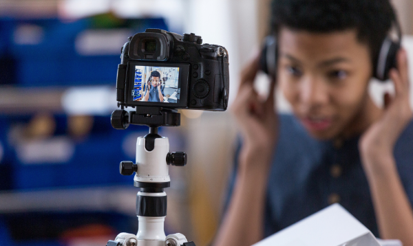 boy filming himself on camera
