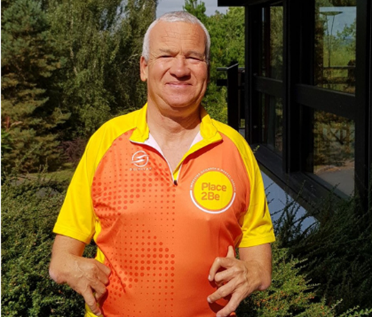 Andrew wearing a Place2Be fundraiser top