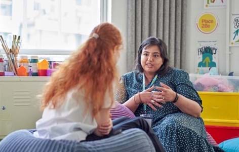 counsellor talking to school pupil in Place2Be therapy room