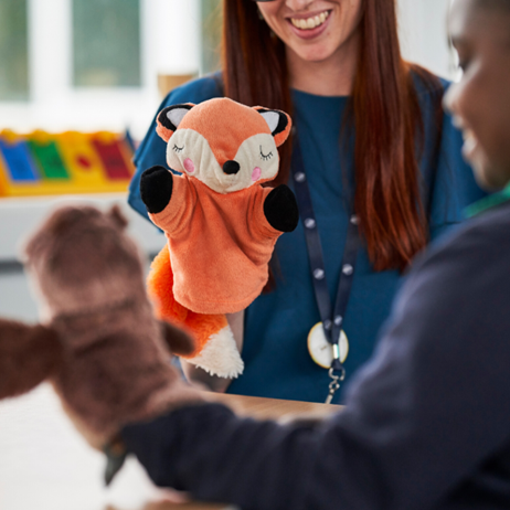 Adult and child with puppets