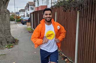 Place2Be fundraiser wearing a Place2Be top running